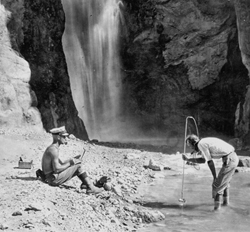 E.C. LaRue measuring Deer Creek flow